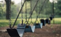 Swinging during recess at an elementary school in Brooklyn during the fall.