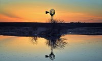 Relaxing by an Iowa pond at sunset.