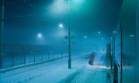 A lonely train ride through a snowy night