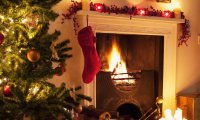 Family Christmas celebrations round the fireplace