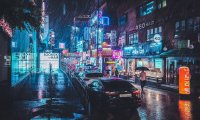 Car driving in the city on a rainy day.