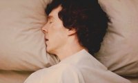 Sleeping next to Sherlock Holmes with the rain at the window