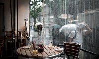 Relax at cafe during heavy rain with thunder outside