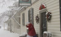 Midwinter meditation by a fireplace in a cozy, snow covered, colonial cottage.