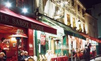 Busy street café on rainy day