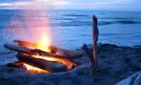 Fire on a rocky beach