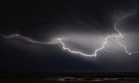 Wooden Ship at Sea in the Night during a gentle Storm