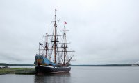 A group of seamen repair their ship