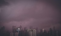 Taking a boat through a city during a rainstorm