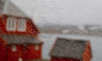 Rain drips off the angled roof and you can hear it hit the forming puddles below.