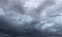 Distant rolling thunder approaches as the wind gently hums through the dry grass