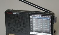 Sitting by a shortwave radio at night scanning for suspicious signals