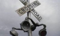 Train crossing in the rain