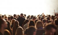 An outdoor crowd with a light wind