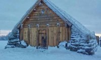 Viking longhouse after battle