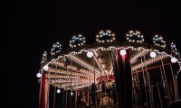 Carnival with carousel and barker, horses and city sounds