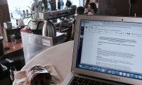 writing in a cozy coffee shop